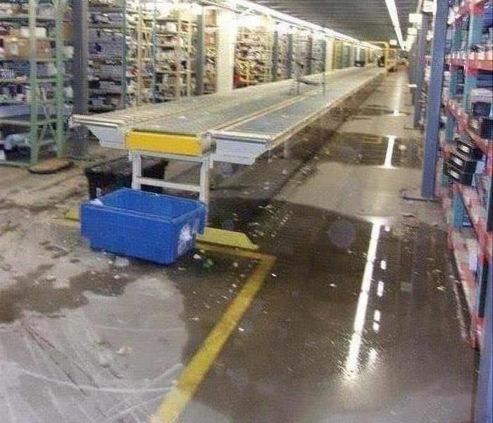Pool of water in warehouse. 